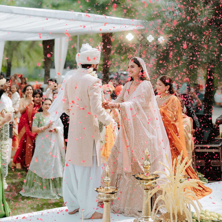 Bride and groom celebrating their traditional Kerala wedding function with family and loved ones.
